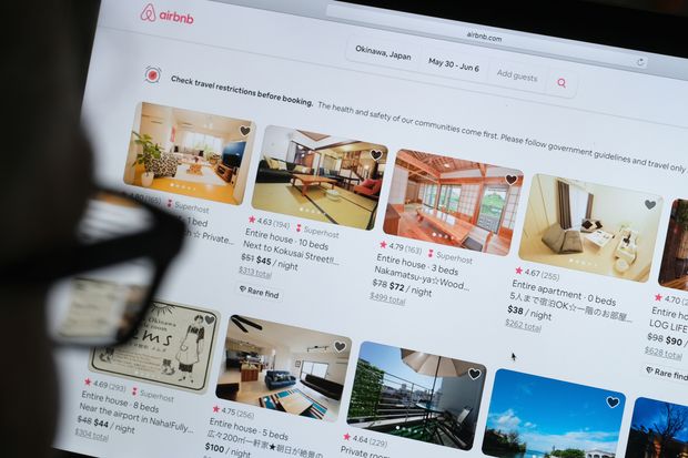 Person searching listings on Airbnb